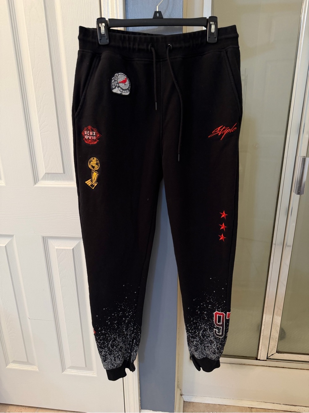 Staple Black Jogger Sweatpants with Red and Gold Accents